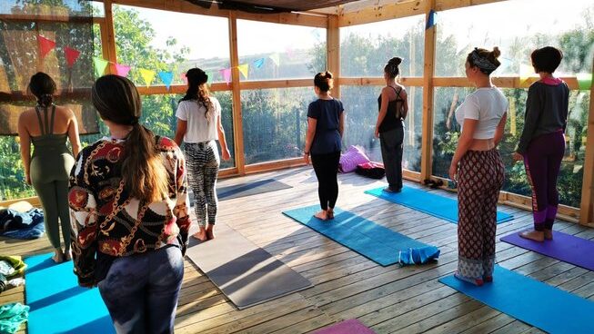People standing a pose for yoga at Surfcamp 360 surf camp