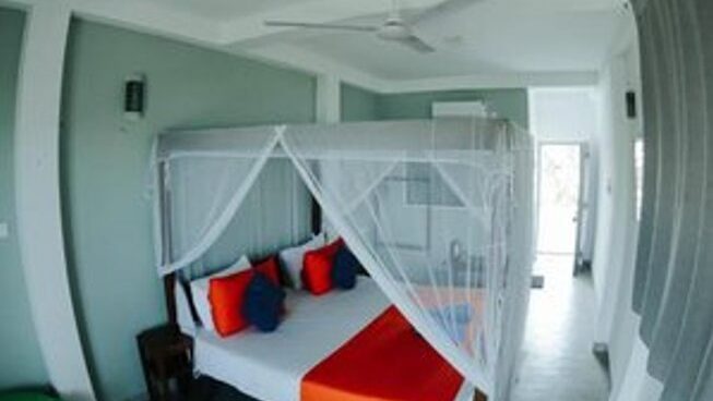 accommodation with bed at Surfers Paradise Weligama surf camp