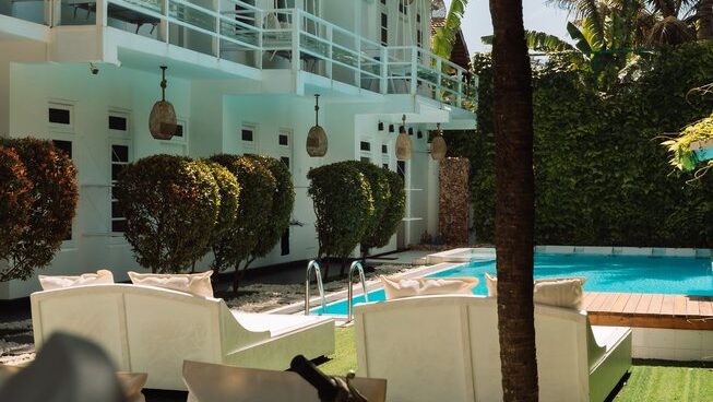Sun beds and pool at The Surfer Weligama surf camp