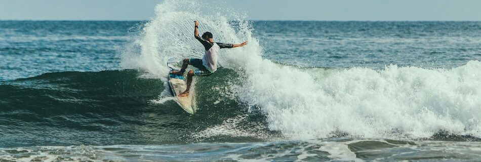 a surfer doing a turn at all inclusive Sri Lanka surf camp