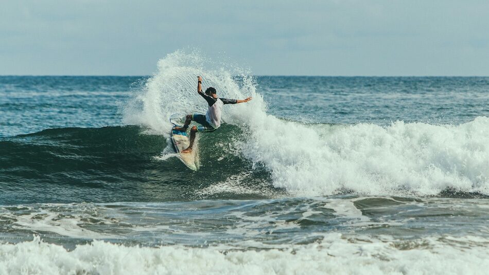 a surfer doing a turn at all inclusive Sri Lanka surf camp