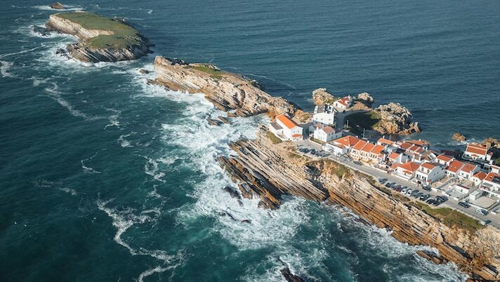 Drone shot of peniche and peniche surf camps with ocean