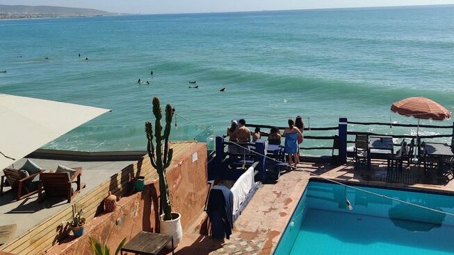 Pool and ocean views of Tamraght surf at Allride Surfer surf camp Taghazout