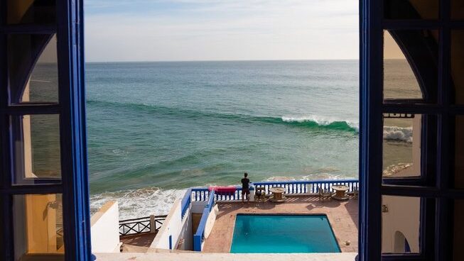 window looking out to pool and surf with Allride Surfer surf camp Taghazout