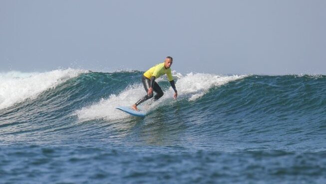 a learner surfer riding a wave at Fuerteventura with Homegrown