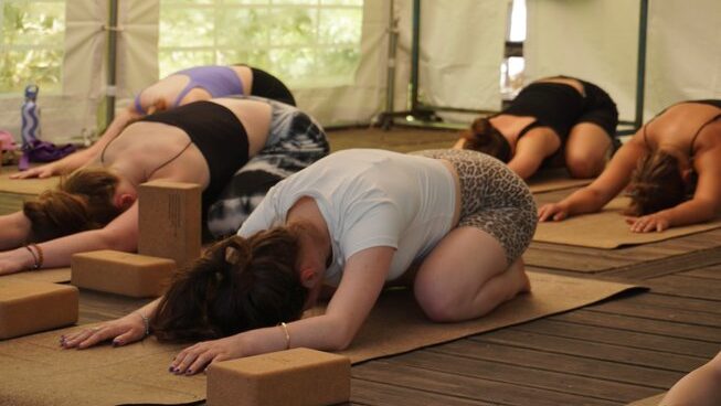 People doing yoga at Maceda Surf Camp in Porto