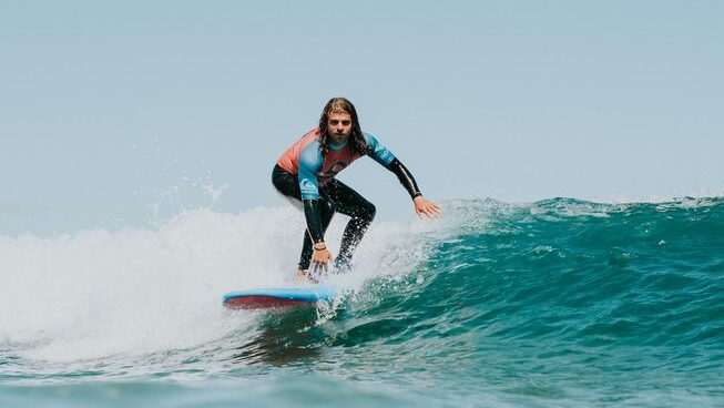 A learner surfer on a wave with Oceanside Gran Canaria Surf camp