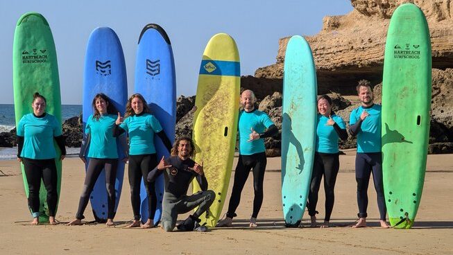 learner surfers with their surfboards on the beach at Surf Paradise Morocco surf camp