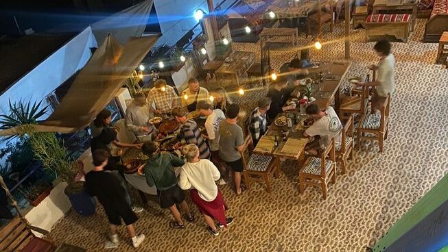 people hanging around outside at night at Surf Paradise Morocco surf camp