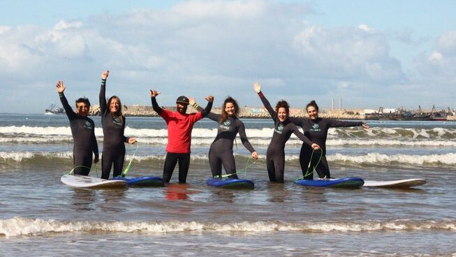 people in the water with surfboards Atlanticzin Watersports with queen bed