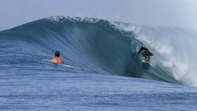 A surfer in a barrel at Hidden Bay Resort Mentawais