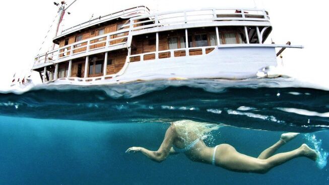 A person snorkelling on Maki boat surf camp