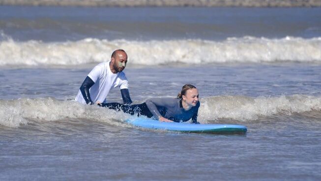 A surfer learning on a wave with Naneakite surf camp Essaouira