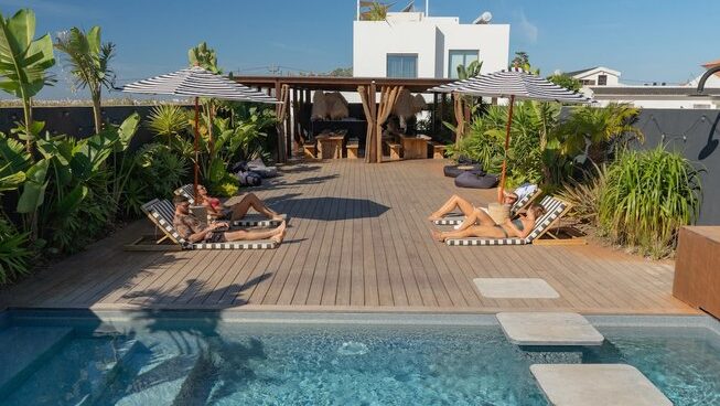 people laying by the pool at The Salty Surf and Yoga surf camp