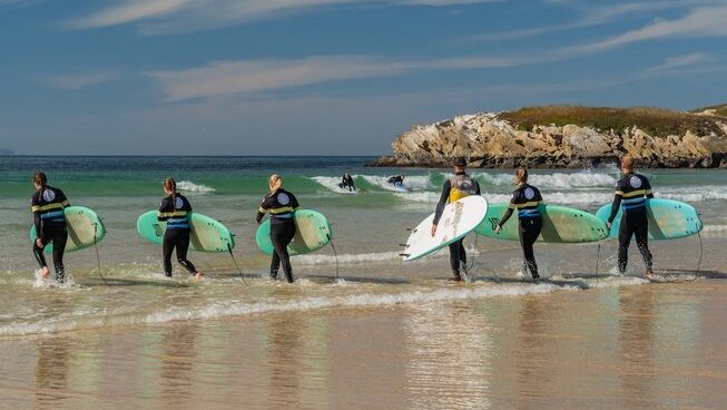 People surfing with The Salty Surf and Yoga surf camp