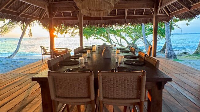 Dining table overlooking water at VAYA Mentawai surf camp