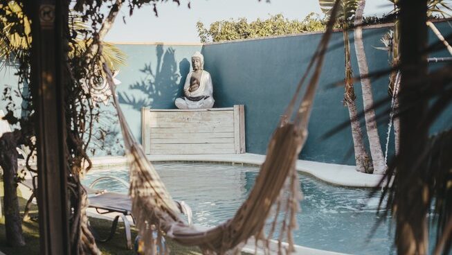 pool and hammock at 9Pies Surf School El Palmar