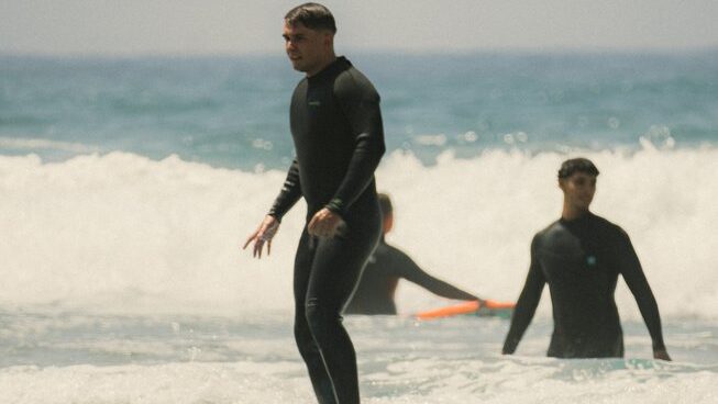 A learner surfer riding a wave with Anamar Surf Morocco