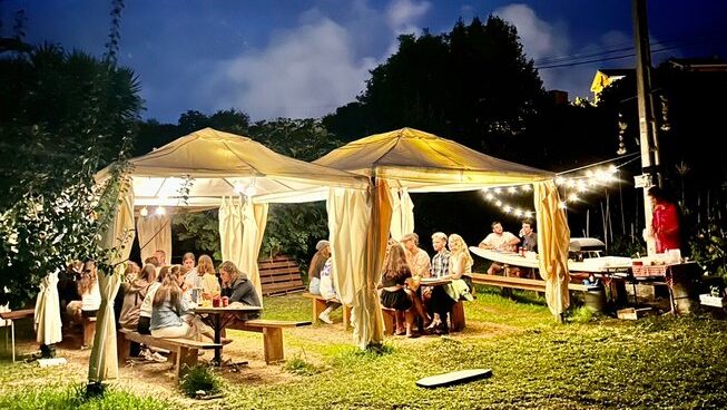 Bio Surf Camp at night with gazebos and night lights