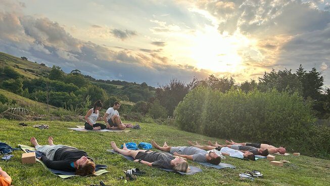 A group of people doing yoga with Bio Surf Camp