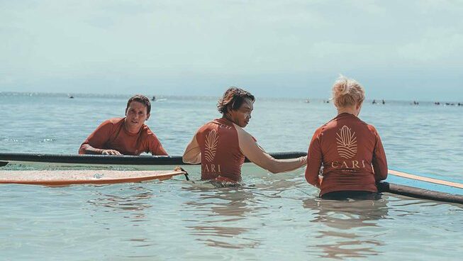two surfers and an instructor at Indonesia surf camp CARI Surf Camp Bali