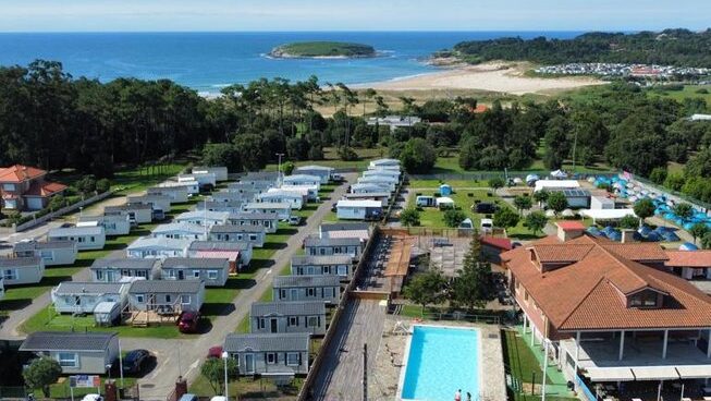 Drone view of Escuela Cantabra De Surf Quicksilver Roxy and ocean and pool