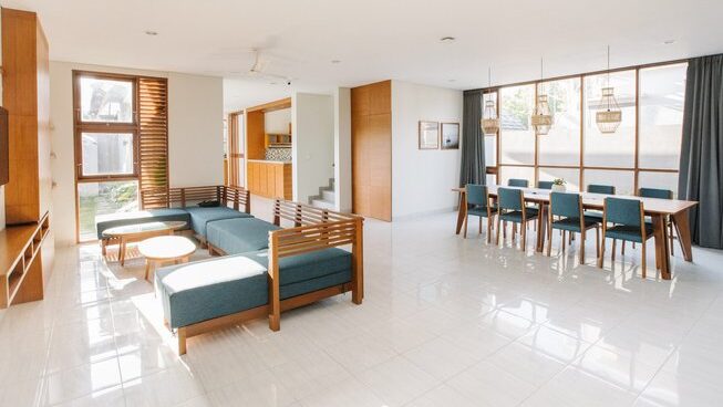 Living area with tables at In Da Surf Bali Indonesia surf camp