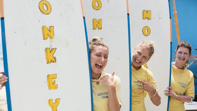 Learners with their surfboards posing at Isla Indah Retreat and Monkey Surfing