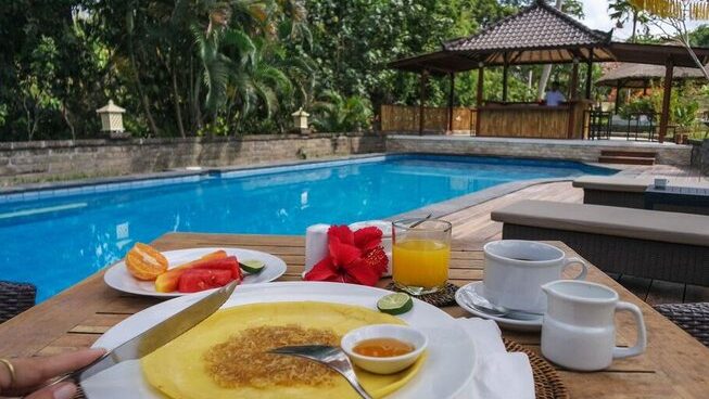 Breakfast served by the pool at Mondo Surf & Lifestyle Village