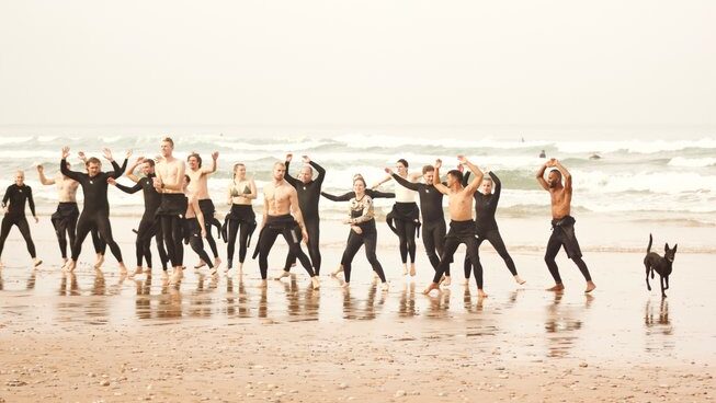 people jumping on the beach at Sunny Wave Taghazout surf camp