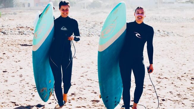 Two learners surfers with Surf Soul Adventure surf camp