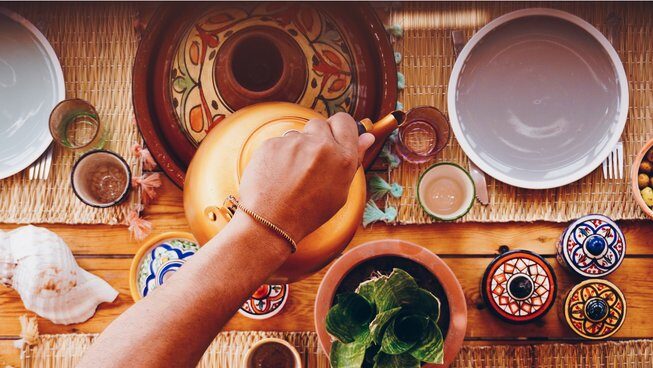 someone pouring tea at Surf Soul Adventure surf camp