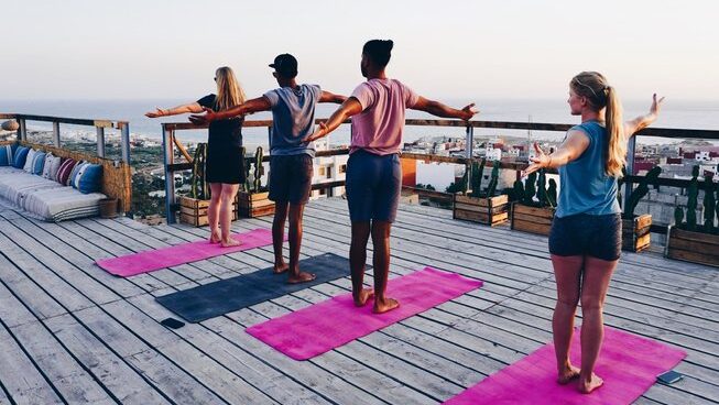 Students practicing yoga with Surf Soul Adventure surf camp