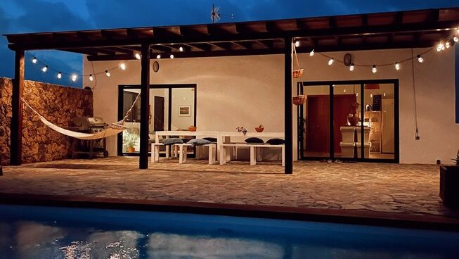 Surf & Yoga Retreats Fuerteventura at night with pool