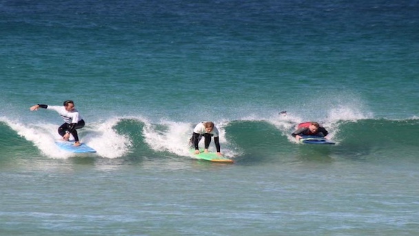 A surfer on wave during their time on a Fuerteventura surf holiday