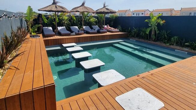 pool with deck chairs at The Salty Peniche surf camp