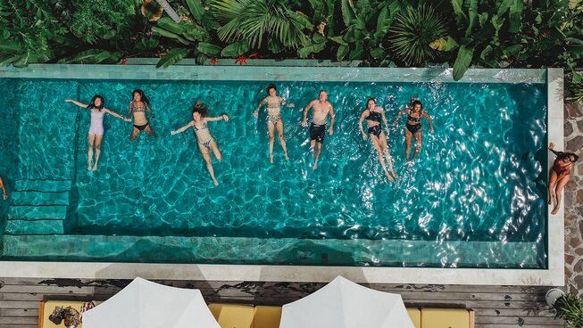 drone shot of people in the pool at Xanadu Surf & Yoga