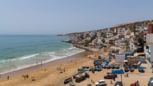 The town of Taghazout and the ocean showing why are surf camps in Morocco safe and welcoming