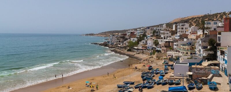 The town of Taghazout and the ocean showing why are surf camps in Morocco safe and welcoming