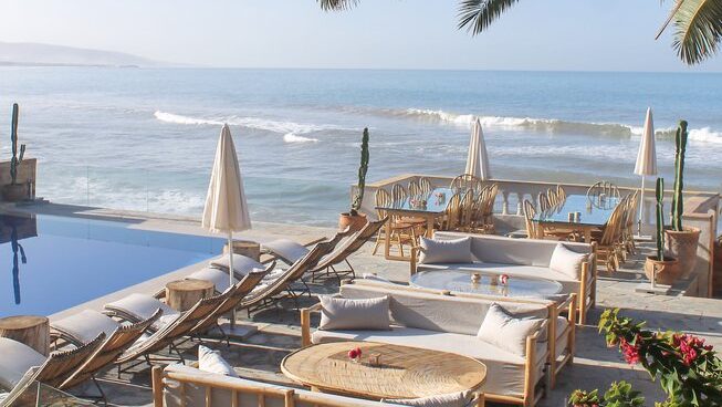 Ocean view with deck chairs at a Taghazout surf camp and yoga retreat