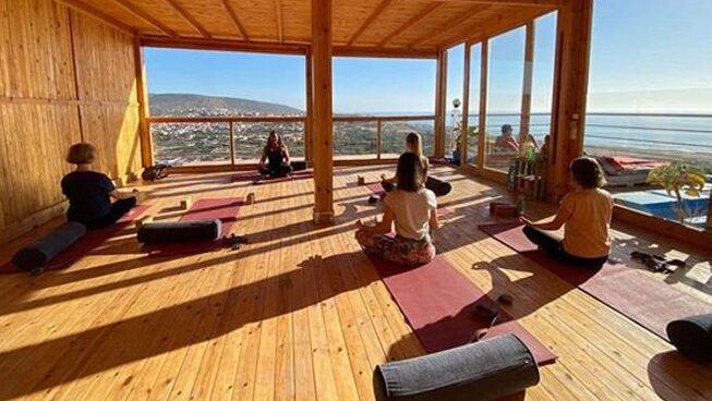 students in a yoga class at a Taghazout surf camp and yoga retreat