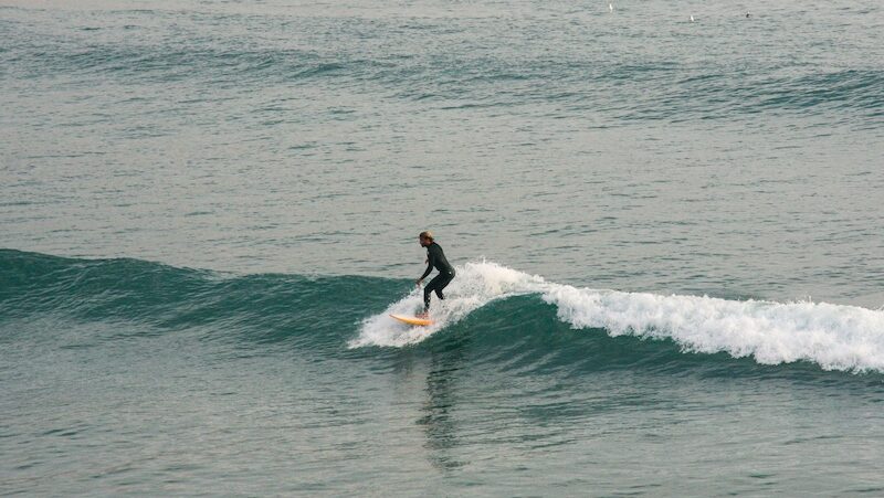 a surfer on a wave during his time at Imsouane Surf