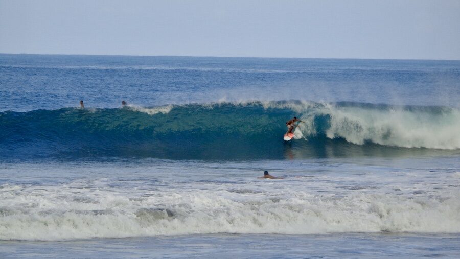 a surfer on a wave in Santa Teresa surf