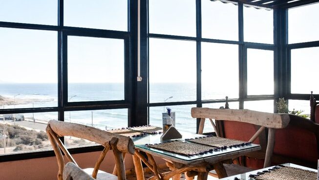 Seating with ocean views at The Petit Surfer surf camp in Imsouane