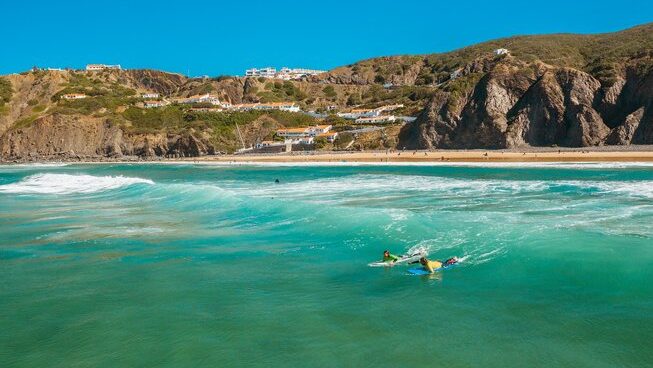 People in the ocean enjoying Lagos surf