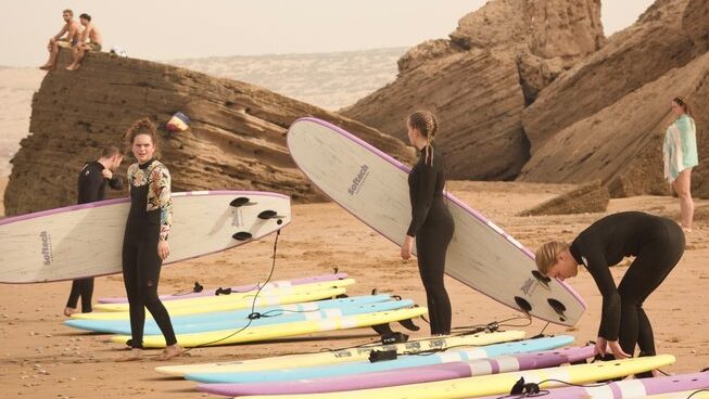 Learner surfers getting ready to surf at Taghazout