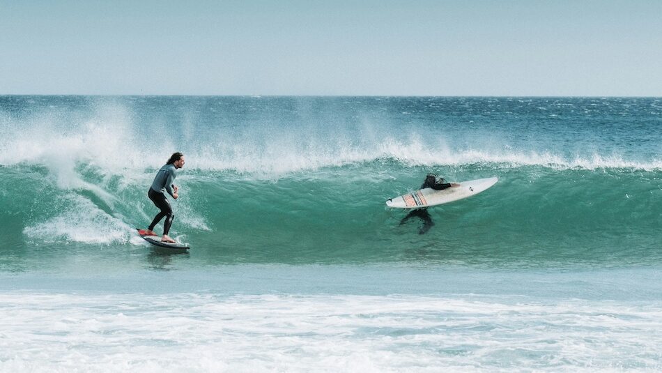 A surfer on a small clean wave in Portugal