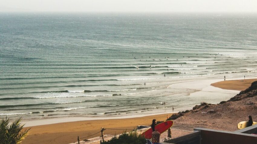 Imsouane Morocco surf break with surfer exiting water