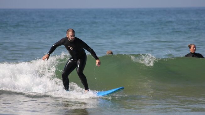 Surfer on a wave in Taghazout with Surf Coast Morocco
