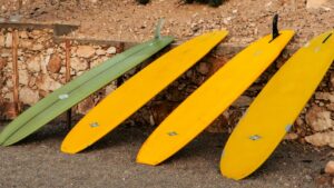long malibu surfboards lined up when surfing Morocco without a car